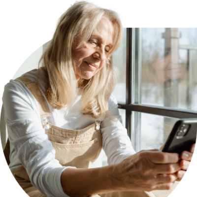 Older woman sat in bright natural light